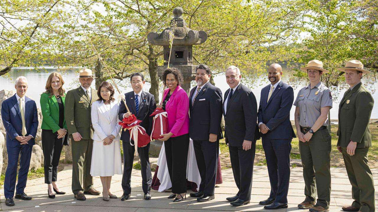 Japan and United States dignitaries gather for the cherry tree ceremony.