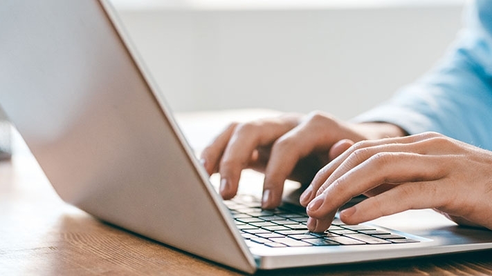 A person working on a laptop computer