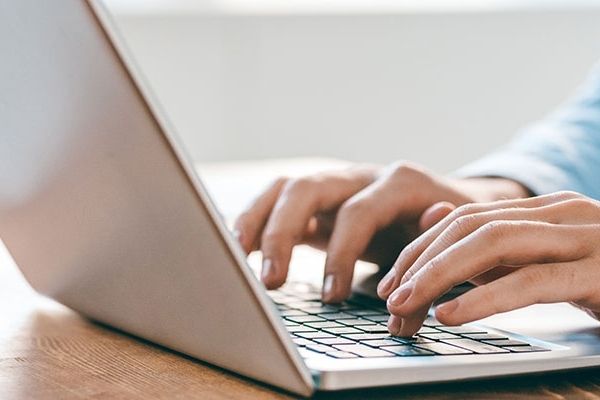 A person working on a laptop computer