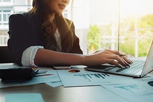 photo of a woman using a computer