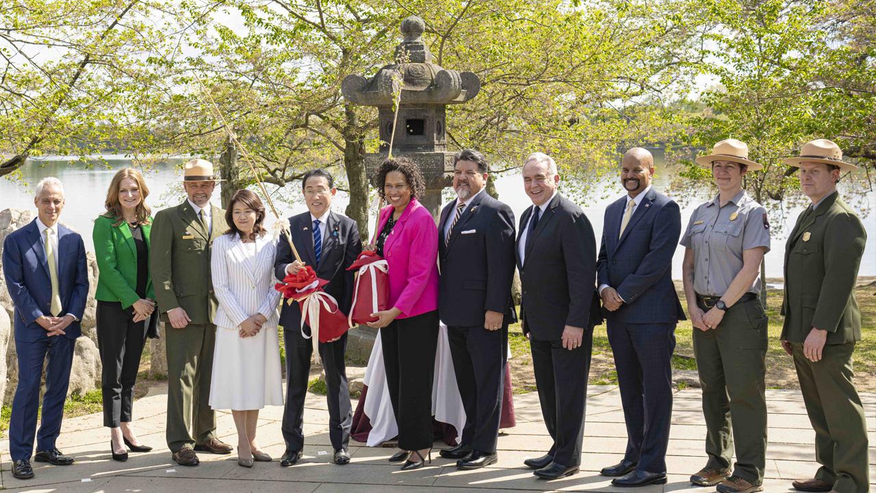 Japan and United States dignitaries gather for the cherry tree ceremony.