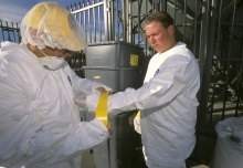 technicians wearing protective gear